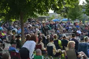 Male lead singer of The Crown Jewels in the middle of a crowd at the Draw