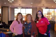 EDA Breakfast 2026 three ladies posing with big smiles windows behind them