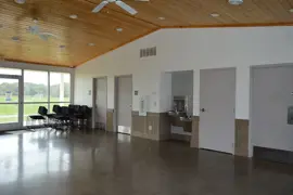 Inside the Elmcrest Park building facing the restrooms and drinking fountain