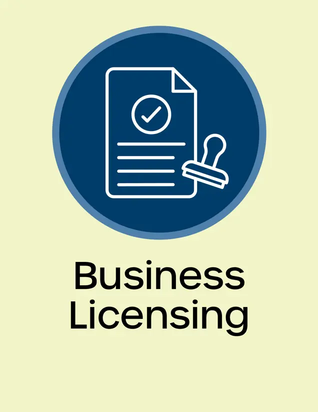 Business Licensing Icon sheet of paper with a stamp next to it checkmark in the middle Opens in new window