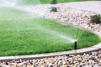 Irrigation Photo automatic sprinklers watering a lawn