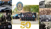 Police department staff with 50 year anniversary badge