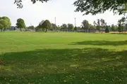 Spacious green field at Central Park with links painted in the grass for soccer or football