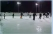 Skater on an outdoor rink under flood lights
