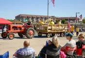 Tractor pulling a hay wagon the boy scouts on wagon