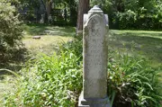 Trott Brook Cemetery summer old obelisk shaped headstone approx 3 feet tall, day lilies