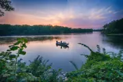 Fishing on the Mississippi River at sunset, boat on water, Ron Herst photographer