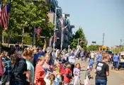 Large crowd at the parade, cheering the floats