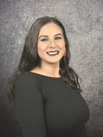 Council member Kirsten Buscher smiling has long hair 