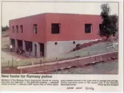 Newspaper article with a picture of the police department being built.