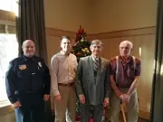 Four Former Ramsey Police Chiefs standing in a line: Katers, Way, Gustafson, and Auspos.