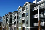 Three-story apartment building with balconies